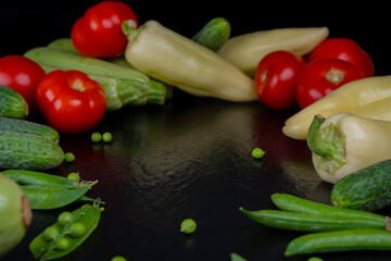 background with vegetables on a black background. copy paste. template for text, mocap