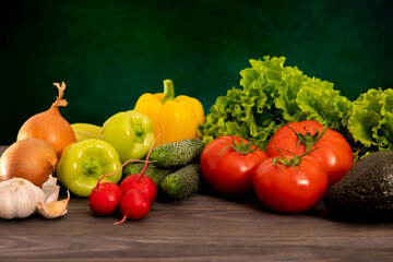 Composition with assorted raw organic vegetables on a dark background. Detox diet.