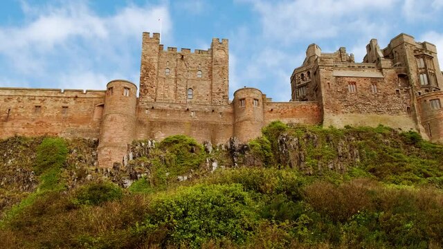 Wide view of Bamburgh Castle, dating to 11th century and the seat of the former Kings of Northumbria, Northumberland, England, UK