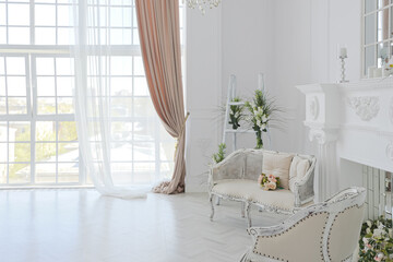 luxurious bright spacious guest room with beautiful chic furniture a huge floor-to-ceiling window...