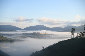 sunrise on the hill range with dramatic lights and dreaming fog flows on the valley