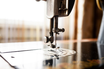 Vintage sewing machine close up in home interior