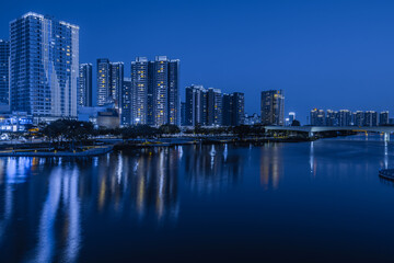 Fototapeta na wymiar Night view of buildings on the bank of the Jiaomen River in Nansha District, Guangzhou