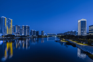 Night view of buildings on the bank of the Jiaomen River in Nansha District, Guangzhou