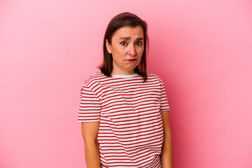 Obraz premium Middle age caucasian woman isolated on pink background sad, serious face, feeling miserable and displeased.