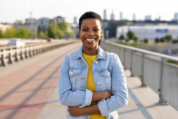 Portrait of smiling young woman in the city
