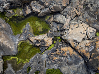  Abstract shot of archipelago, coastline, cliffs and vegetation. Aerial, drone photography from above, northern Gothenburg in Sweden. Place for text, copy space.