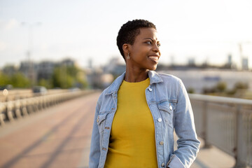 Portrait of smiling young woman in the city

