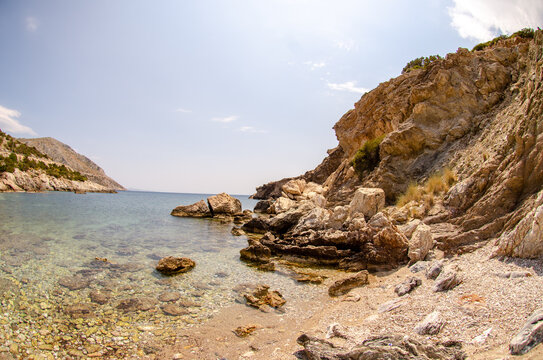 Beautiful scenery of rocky beach in Anavyssos, Greece on a fine day