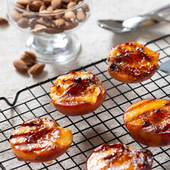 Healthy dessert juicy barbecue peaches with peaches ice cream on the grill