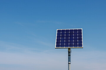 Green energy concept, Solar cell panel pole with blue sky on sunny day, Photovoltaic cell is an...