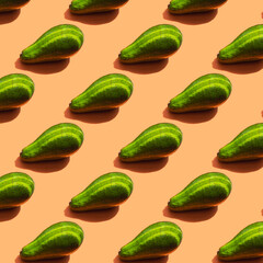 A pattern of ripe green avocado with shadow and stripes from the light