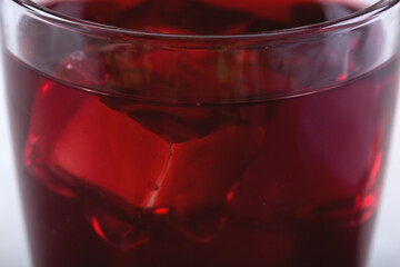 Close-up wine in a glass with ice. Summer drink