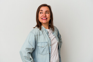 Middle age caucasian woman isolated on white background laughs happily and has fun keeping hands on...