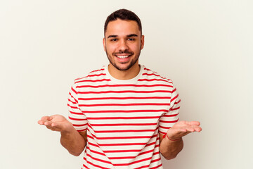 Young caucasian man isolated on white background showing a welcome expression.