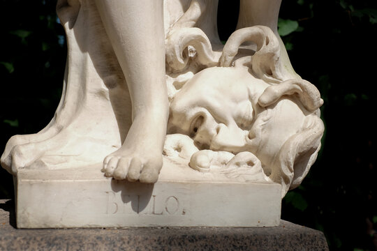 Head of Medusa Gorgon and leg of goddess Bellona, anticue statue in Summer garden, Saint-Petersburg, Russia