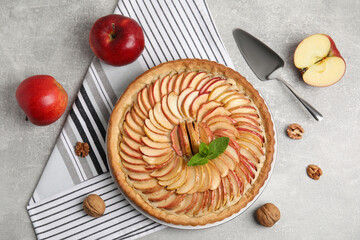 Flat lay composition with delicious homemade apple tart on grey table - obrazy, fototapety, plakaty