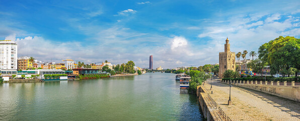 Fototapeta premium Guadalquivir river and Torre del Oro tower (Gold tower) in Seville. Andalusia, Spain