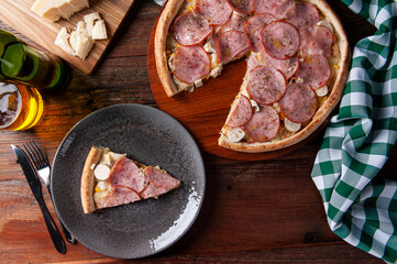 .Brazilian-style sirloin pizza with mozzarella, hearts of palm and corn. Top view. Copy space