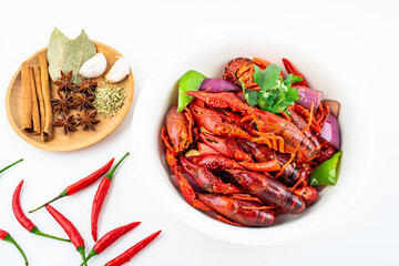 Spicy crayfish in a pot on white background