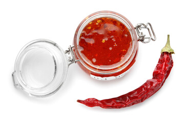 Jar of hot honey and dry chili pepper on white background
