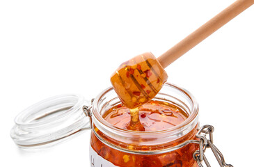 Jar of hot honey on white background, closeup