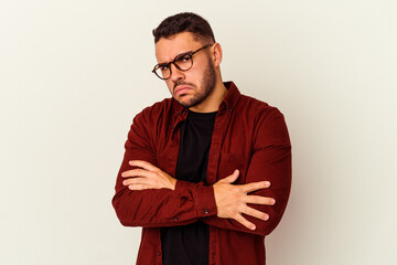 Fototapeta premium Young caucasian man isolated on white background tired of a repetitive task.