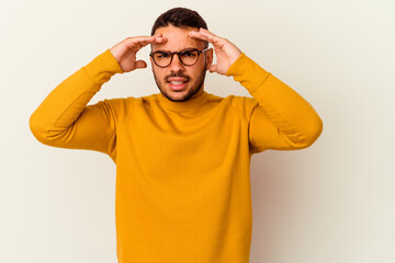 Young caucasian man isolated on white background receiving a pleasant surprise, excited and raising hands.