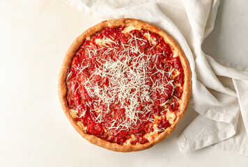 Tasty Chicago-style pizza on light background