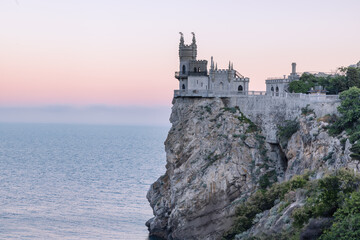 Fototapeta na wymiar Swallow's Nest is a decorative castle located near Yalta in the Crimean Peninsula. It was built between 1911 and 1912, on top of the 40-metre (130 ft) high Aurora Cliff