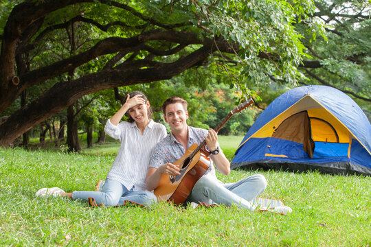 Sweet couple relaxing on picnic in park, beautiful lover spending time together and having romantic moment
 - Powered by Adobe