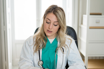 Female doctor interacting with patient in online video call. Screen point of view