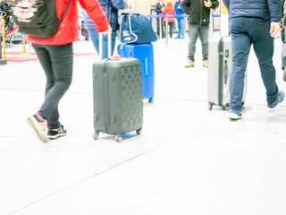 few traveler with travel suitcase luggage walking in airport terminal hall walkway for vacation business concept vacationing travel. Social distancing during coronavirus