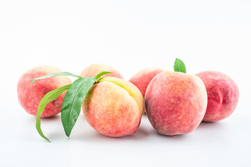 Fresh peaches on white background