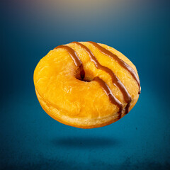 Delicious donut on blue background