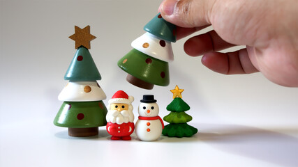 Christmas decorations Santa Claus dolls, snowmen and hand-picked pine trees on a white background.