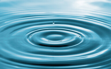 Closeup of transparent water droplet on water ring surface , Natural concept.