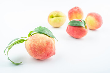 Fresh peaches on white background