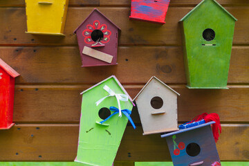 Many colorful birdhouses, wooden houses for birds as a symbol of wish fulfillment