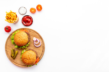 Homemade burgers on serving board. Fastfood meal background