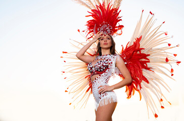 Pretty, attractive Samba dancer on bright background 