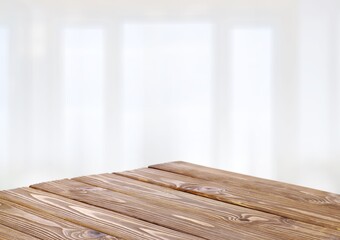 Blank wooden table top on blur room background