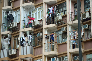 windows and balconies with drying linen in a multi-storey building 