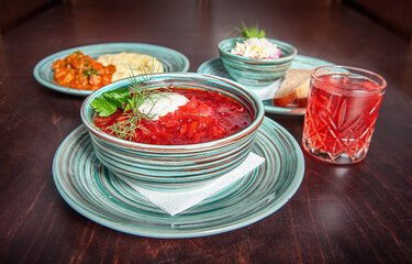 Traditional beetroot soup borscht with fresh parsley .