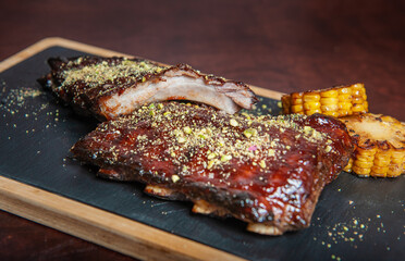 Spicy hot grilled caramelised pork ribs with corn