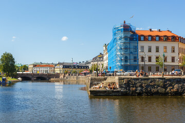 Canal in Gothenburg with sunbathing people
