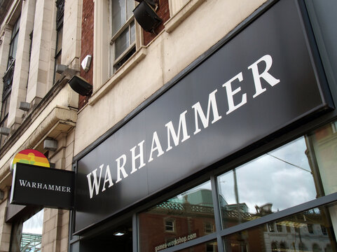 leeds, west yorkshire - 19 June 2021:  sign and logo above a warhammer games store store on briggate in leeds city centre