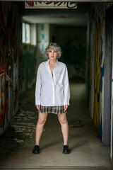 model posing in front of a wall