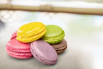 Colorful tasty cake macaroons on a light background.