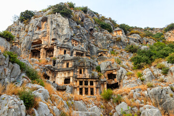 Obraz premium Rock-cut tombs of Lycian necropolis of the ancient city of Myra in Demre, Antalya province in Turkey